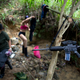 Rebels use trees to hang clothes and weapons.